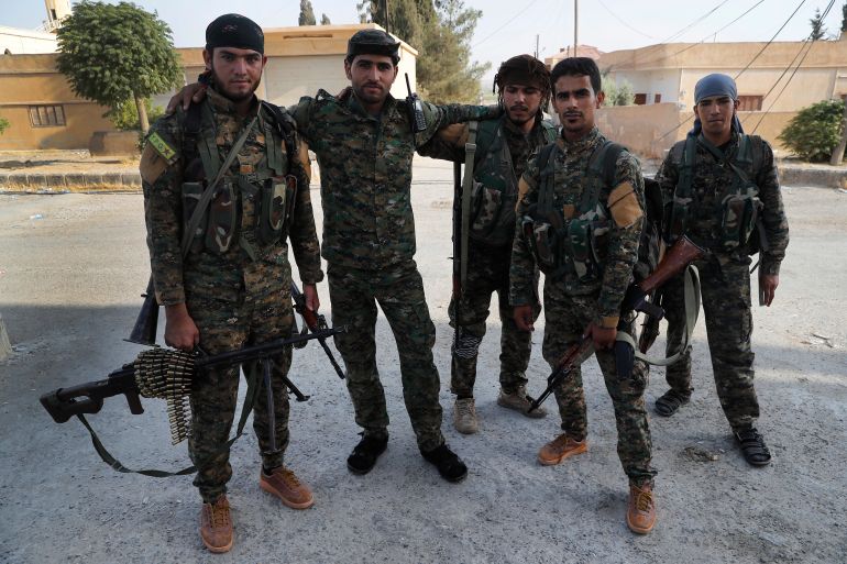 Arab and Kurdish fighters with the U.S.-backed Syrian Democratic Forces (SDF)