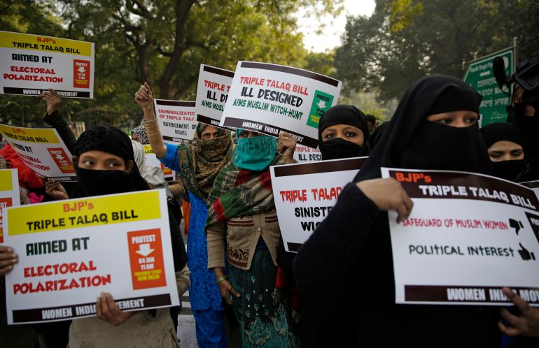 Indian Muslim women and members of Women India Movement hold placards as they march againsta new draft law for banning "Triple Talaq", a Muslim practice of instant divorce which was approved last week by India's lower house in New Delhi, India, Thursday, Jan. 4, 2018. Several opposition parties criticised Prime Minister Narendra Modi's government for not discussing the legislation with them before introducing it in parliament. The bill now needs the approval of the upper house of parliament, before it becomes law. (AP Photo/Altaf Qadri)