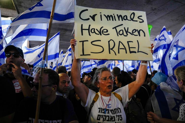 Israelis protest against plans by Prime Minister Benjamin Netanyahu's government to overhaul the judicial system, at Ben Gurion Airport in Lod, near Tel Aviv, Israel