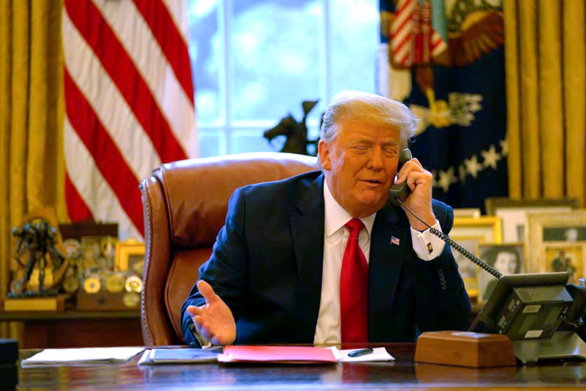 President Donald Trump talks on the phone to Vice President Mike Pence from the Oval Office of the White House on Jan. 6