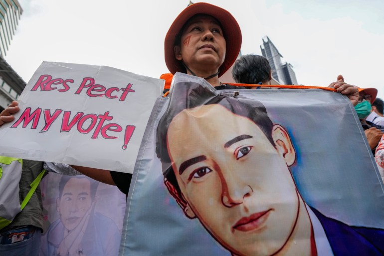 Supporters of the Move Forward Party hold a portrait of Pita Limjaroenrat, the leader of Move Forward Party, during a protest in Bangkok, Thailand, Saturday, July 29, 2023.