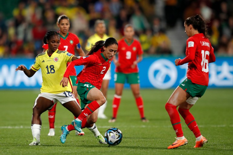 Colombia's Linda Caicedo, left, challenges Morocco's Zineb Redouani, center, during the Women's World Cup