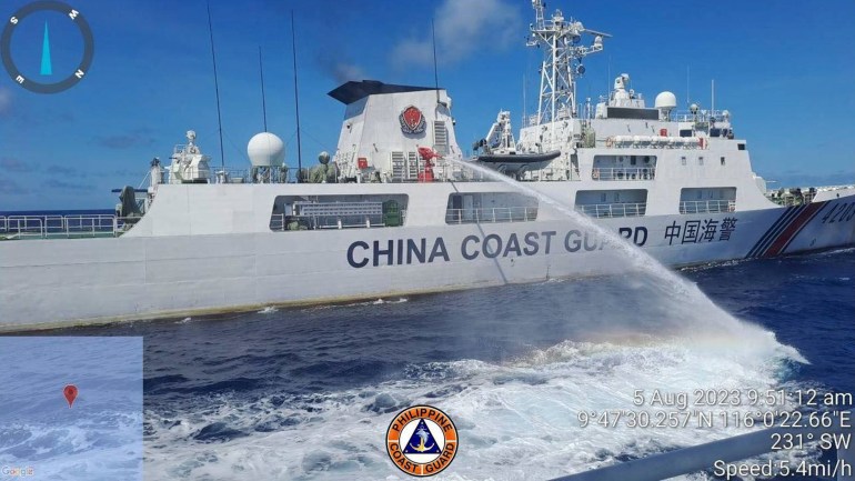 In this handout photo provided by the Philippine Coast Guard, a Chinese coast guard ship uses a water cannon on a Philippine Coast Guard ship