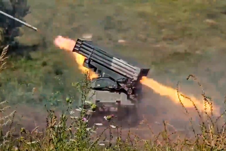 In this photo taken from video released by the Russian Defense Ministry Press Service on Tuesday, Aug. 8, 2023, a Russian multiple rocket launcher fires toward Ukrainian positions at an undisclosed location. (Russian Defense Ministry Press Service via AP)