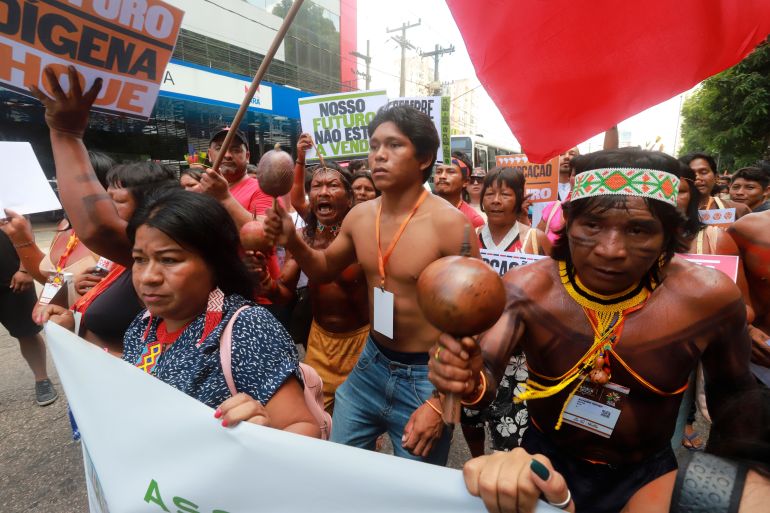 Indigenous people march in defense of the Amazon in Belem, Brazil, Tuesday, Aug. 8, 2023. Belem is hosting the Amazon Cooperation Treaty Organization that is meeting to chart a common course for protection of the bioregion and address organized crime. (AP Photo/Paulo Santos)