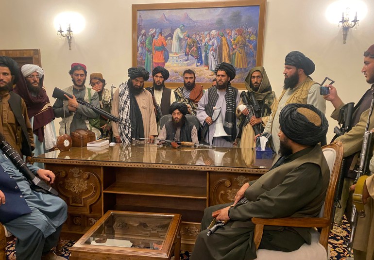 Taliban fighters in the presidential palace