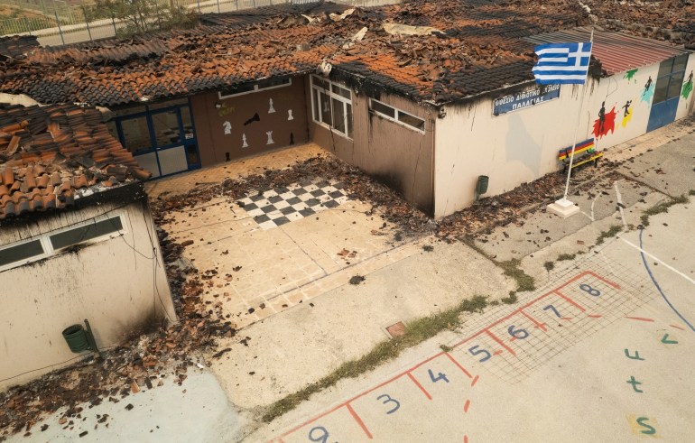 The burnt roof of an elementary school is seen in the village of Palagia, near the town of Alexandroupolis, in the northeastern Evros region
