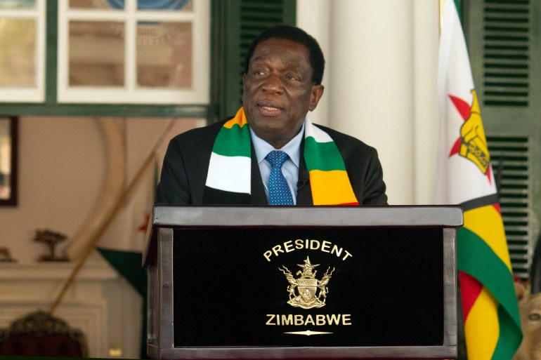 Zimbabwean President Emmerson Mnangagwa speaking after his reelection. He is standing at a lectern in the presidential palace