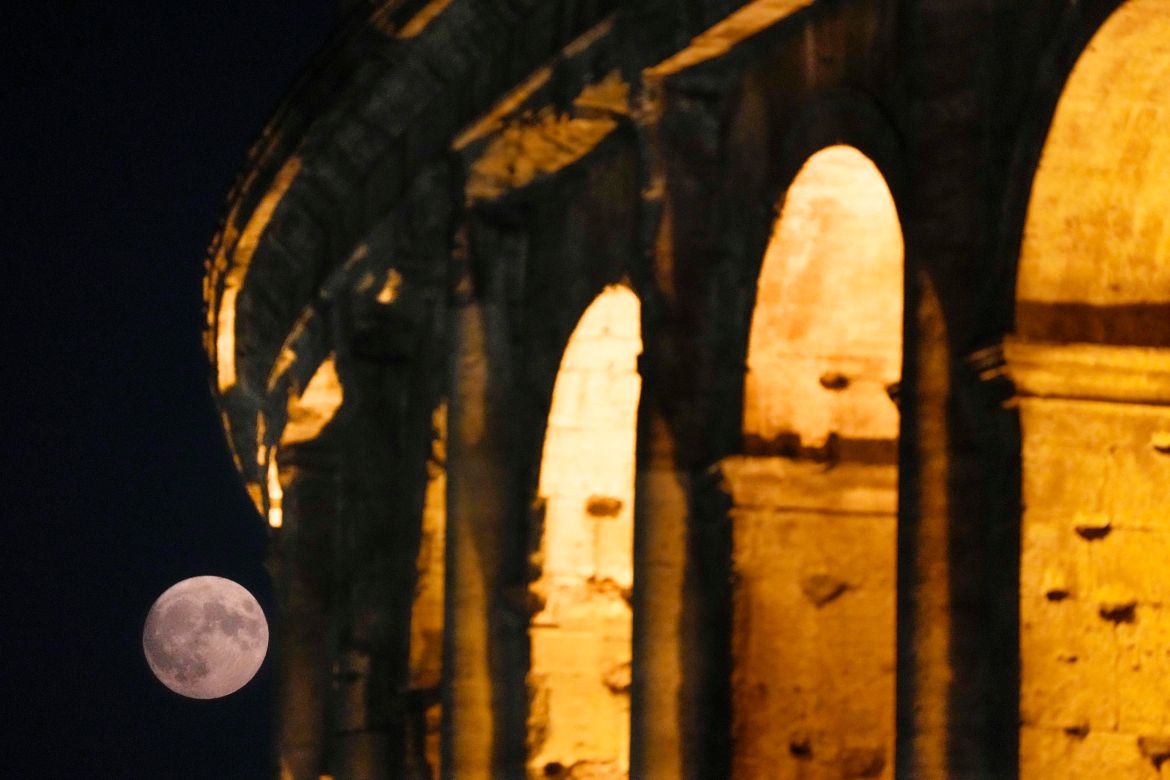 A supermoon rises over the Colosseum in Rome