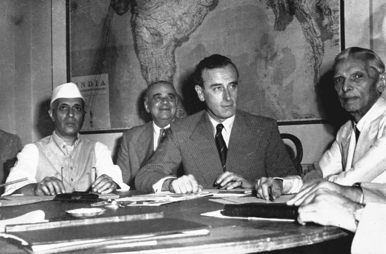 From left, Pandit Jawarharlal Nehru, Vice President of India's Interim Government, Earl Mountbatten, Viceroy of India and Muhammad Ali Jinnah, President of the Muslim League discuss Britain's plan for India at the historic India Conference in New Delhi, June 2, 1947. (AP Photo/Max Desfor)
