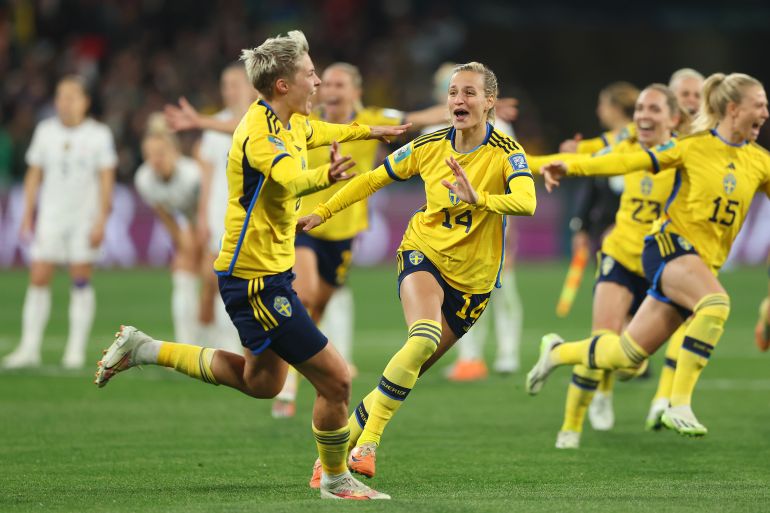 Lina Hurtig of Sweden celebrates with teammates after scoring her sides winning penalty
