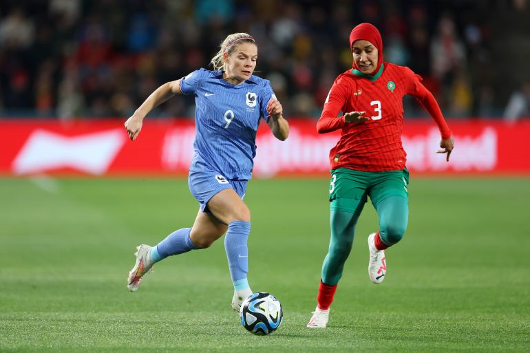Eugenie Le Sommer of France and Nouhaila Benzina of Morocco compete for the ball