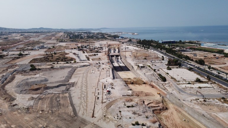 The south-facing Ellinikon project, where developers are preparing to build 2.5 km of coastal road (right) underground to allow better access to the sea. 