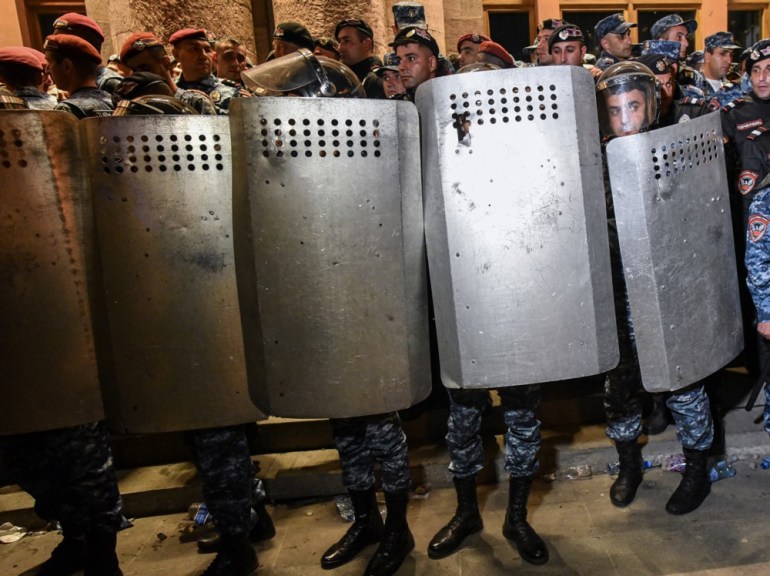 epa10870548 Armenian riot police holding shields stand guard as protesters gather outside the government building during a protest against Azerbaijan's military actions in the Nagorno-Karabakh region, in central Yerevan, Armenia, 19 September 2023. The protesters, voicing anti-government slogans, are demanding the resignation of Armenian Prime Minister Nikol Pashinyan and a stop to Azerbaijan's military operations in Nagorno-Karabakh region. Azerbaijan's Ministry of Defense announced on 19 September the launching of local 'anti-terrorism' measures against the Armenian military in the Nagorno-Karabakh region in order to restore the constitutional order of Azerbaijan and suppress the provocations of the Armenian military. The Karabakh authorities have appealed to Azerbaijan for an immediate ceasefire and to sit down at the negotiation table with the aim of settling the situation. EPA-EFE/NAREK ALEKSANYAN