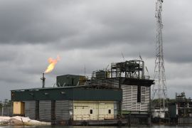 A gas flare burns at the Batan flow station operated by Chevron under a joint-venture arrangement with the Nigerian National Petroleum Corporation (NNPC) for the onshore and offshore assets in the Niger Delta region on March 26, 2018 [Pius Utomi Ekpei/AFP]