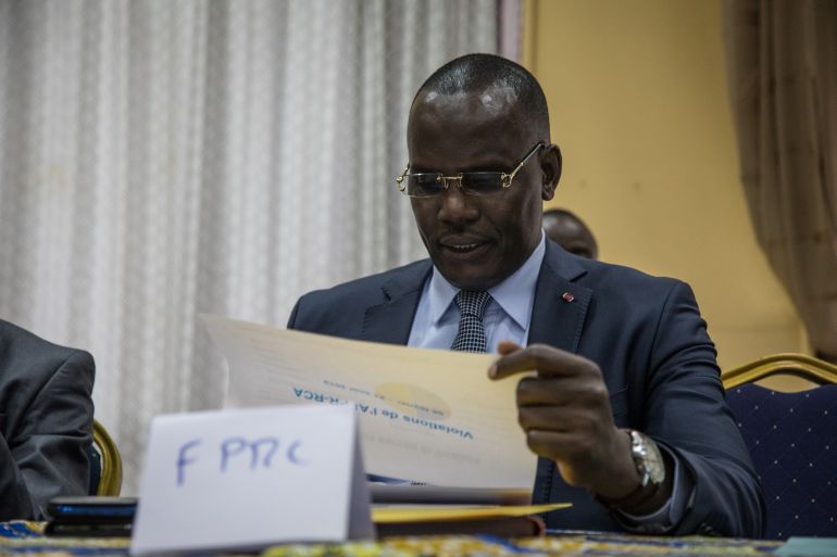 Abdoulaye Hissene, an ex-leader of the FPRC (Popular Front for the Rebirth of Central African Republic) armed group, reads a report on the breaches of the Khartoum agreements by armed groups, in Bangui, on 23 August, 2019