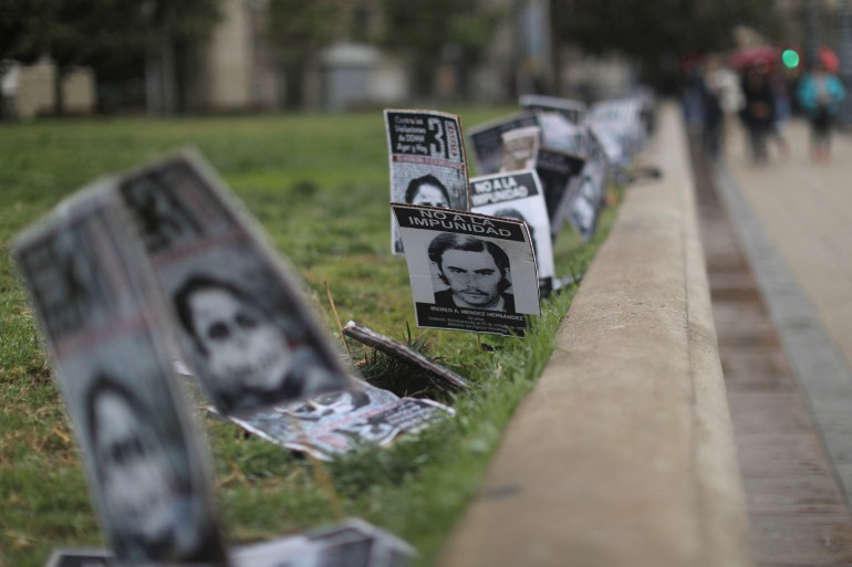 Placards with the image of victims of enforced disappearances during the Pinochet dictatorship in Chile