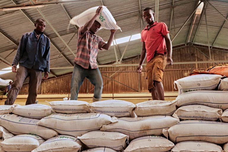 Workers move bags of fertilizer donated to Malawi by Russian company Uralchem in Mkwinda, Lilongwe, Malawi March 6, 2023 REUTERS/Eldson Chagara