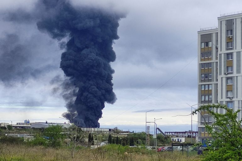 Smoke rises over a fuel tank following an alleged drone attack in Sevastopol, Crimea, April 2023