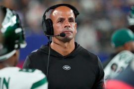 NY Jets head coach Robert Saleh wearing a headset during a game