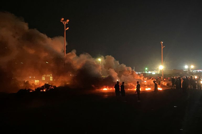 Demonstrators burn tires in protest against the meeting which was held last week in Italy between foreign affairs ministers of Libya and Israel, in Tripoli, Libya.