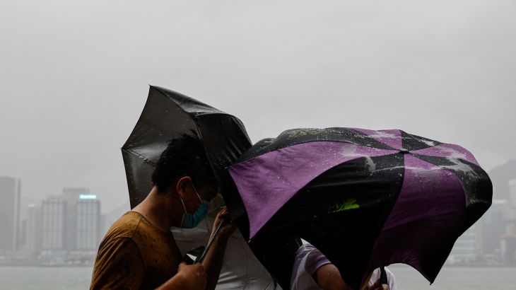 People brave strong winds as Super Typhoon Saola approaches Hong Kong