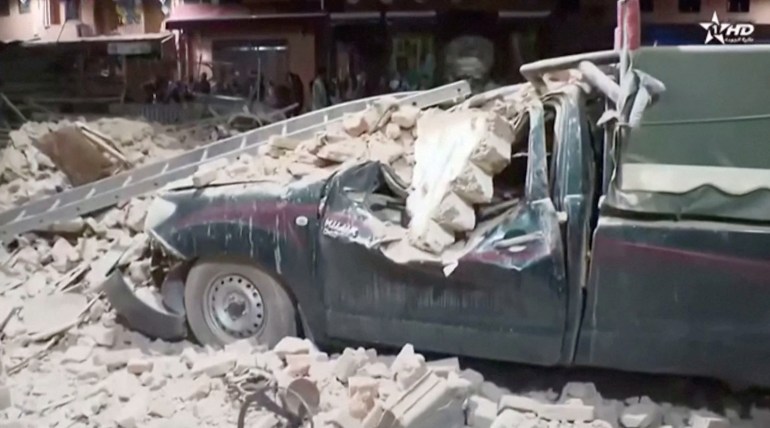 View of a damaged car and debris from the earthquake in Marrakech,
