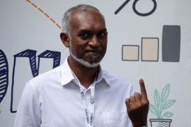 Mohamed Muizzu, Maldives presidential candidate of the opposition party, People's National Congress gestures after casting his vote at a polling station.