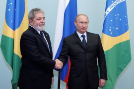Brazil's President Luiz Ignacio Lula da Silva (L) shakes hands with Russia's Prime Minister Vladimir Putin as they meet in Moscow May 14, 2010.