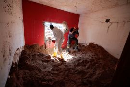 Libyan and Italian rescuers removes mud from a house searching for bodies in the aftermath of the floods in Derna, Libya September 16, 2023. REUTERS/Zohra Bensemra