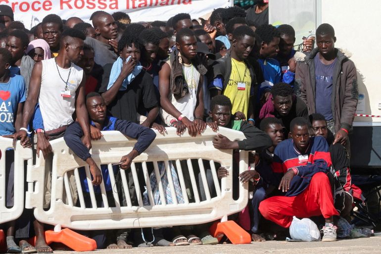 Migrants gather in Italy