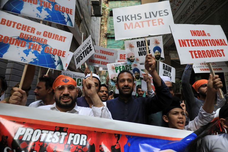 Members of the Pakistan’s Sikh community, chant slogans as they hold placards condemning the assassination of Sikh leader Hardeep Singh Nijjar in June 2023, in Surrey, British Columbia, Canada, during a protest in Peshawar, Pakistan September 20, 2023. REUTERS/Fayaz Aziz