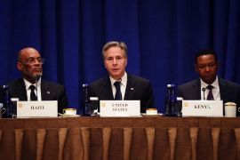 US Secretary of State Antony Blinken, flanked by Haitian Prime Minister Ariel Henry (left) and Kenyan Cabinet Secretary for Foreign and Diaspora Affairs Alfred Nganga Mutua (right) during a meeting on the security situation in Haiti, in New York on September 22, 2023 [Bing Guan/Reuters]