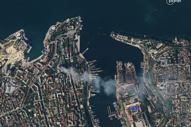 A satellite image shows smoke billowing from Russia's Black Sea Fleet headquarters after the missile strike