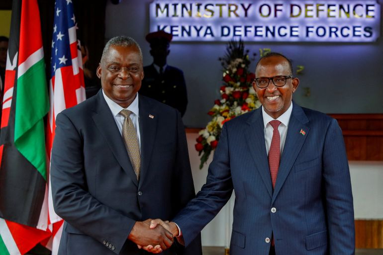 US Secretary of Defense Lloyd Austin and Kenya's Cabinet Secretary for Defence Aden Duale shake hands