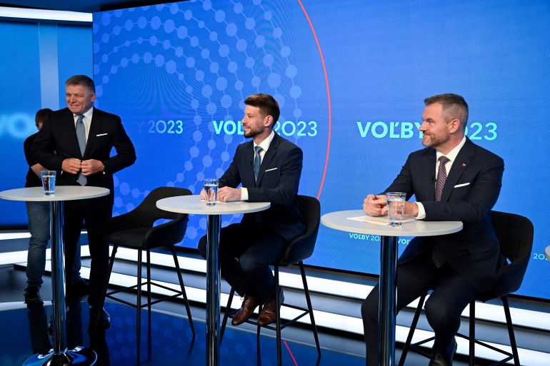 Robert Fico, leader of the SMER-SSD party, Michal Simecka, leader of Progressive Slovakia party, and Peter Pellegrini, leader of HLAS party await for the televised debate to begin at TV TA3, prior to the Slovak early parliamentary election, in Bratislava