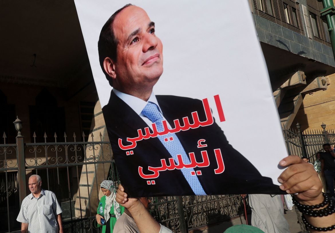 A Sufi Muslim carries a banner in support of Egypt's President Abdel Fattah al-Sisi reading "Sisi my president" for the incoming presidential election, during the celebration of "Mawlid al-Nabawi", or the birth of Prophet Mohammad, in Al Azhar district, Old Cairo, Egypt, September 27, 2023. REUTERS/Amr Abdallah Dalsh