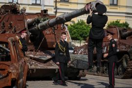 Young Ukrainian military cadets visit an exhibition displaying destroyed Russian armour in Kyiv, Ukraine, on September 29 [File: Gleb Garanich/Reuters]