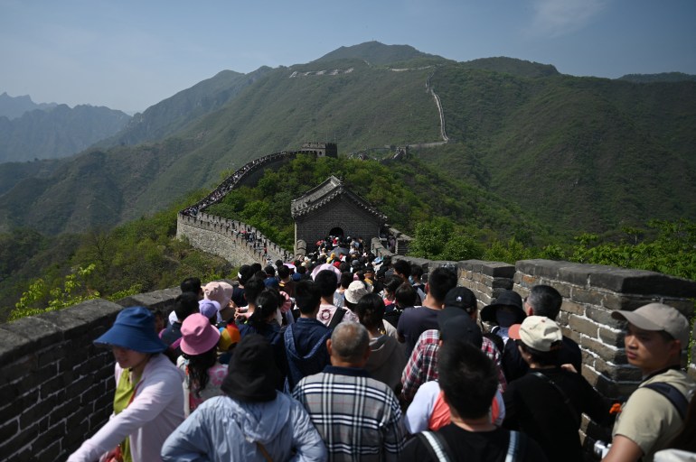 People climb the Great Wall of China at Mutianyu, north of Beijing, on the Labour Day holiday on May 1, 2023.