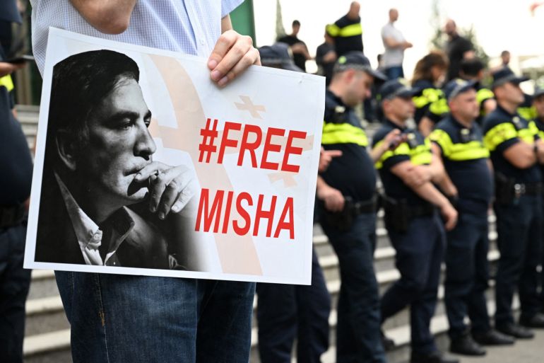 Supporters of Georgia's jailed ex-president Mikheil Saakashvili rally outside a clinic, where the politician is being held, to demand his liberation in Tbilisi