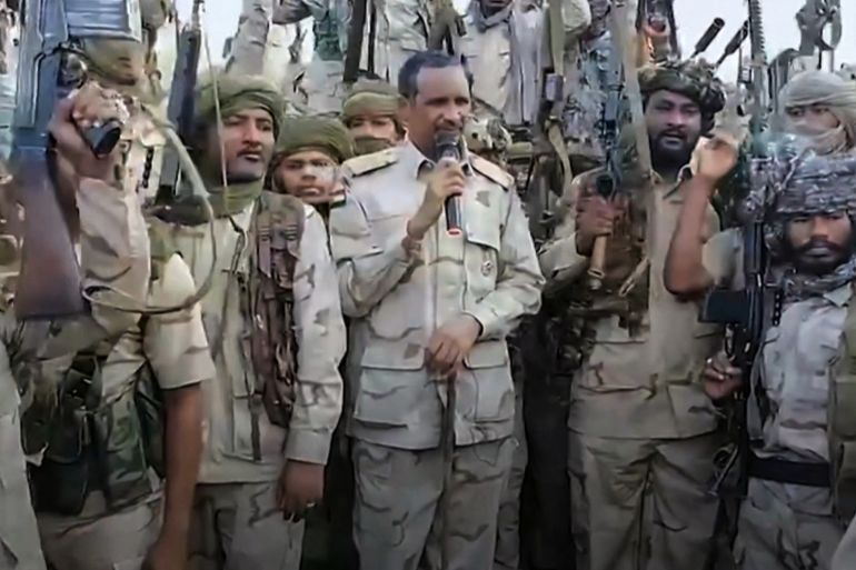 An image grab taken from a handout video posted on the Sudanese paramilitary Rapid Support Forces (RSF) page on Twitter, rebranded as X, on July 28, 2023 shows its commander Mohamed Hamdan Daglo addressing RSF fighters at an undisclosed location. In a five-minute video believed to be his first since the fighting erupted on April 15, Daglo told regular army troops that peace could be restored "within 72 hours" if they handed over their commander General Abdel Fattah al-Burhan and his top aides. (Photo by Rapid Support Forces (RSF) / AFP) / === RESTRICTED TO EDITORIAL USE - MANDATORY CREDIT "AFP PHOTO / HO / SUDAN'S RAPID SUPPORT FORCES TWITTER PAGE" - NO MARKETING NO ADVERTISING CAMPAIGNS - DISTRIBUTED AS A SERVICE TO CLIENTS === - === RESTRICTED TO EDITORIAL USE - MANDATORY CREDIT "AFP PHOTO / HO / SUDAN'S RAPID SUPPORT FORCES TWITTER PAGE" - NO MARKETING NO ADVERTISING CAMPAIGNS - DISTRIBUTED AS A SERVICE TO CLIENTS === /