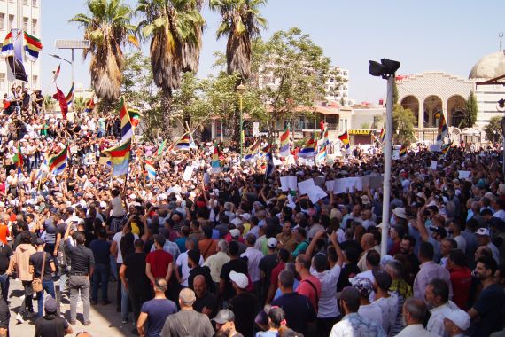 People protest in the Syria's southern city of Sweida on September 1, 2023. The protests in Sweida province, the heartland of the country's Druze minority, began after President Bashar al-Assad's government ended fuel subsidies last month.