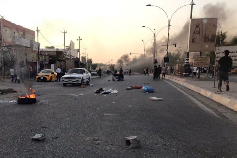 Iraqi protesters block a road in Kirkuk