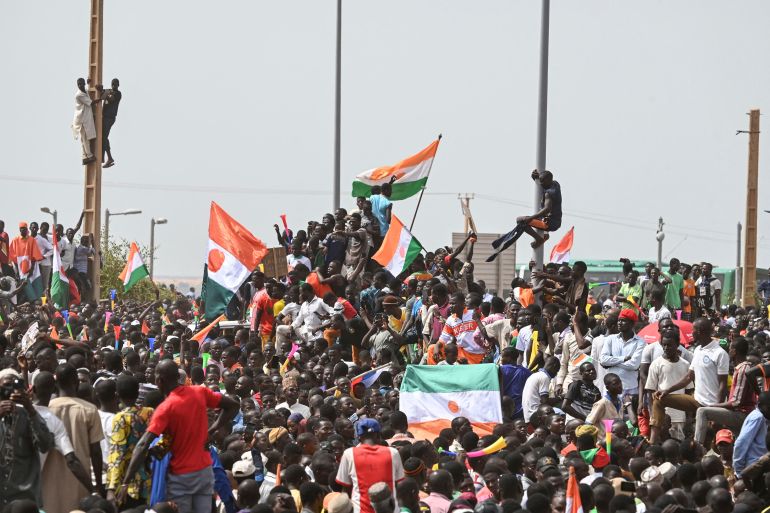 Supporters of Niger's National Council of Safeguard of the Homeland (CNSP) protest outside the Niger and French airbase in Niamey on September 2, 2023 to demand the departure of the French army from Niger.