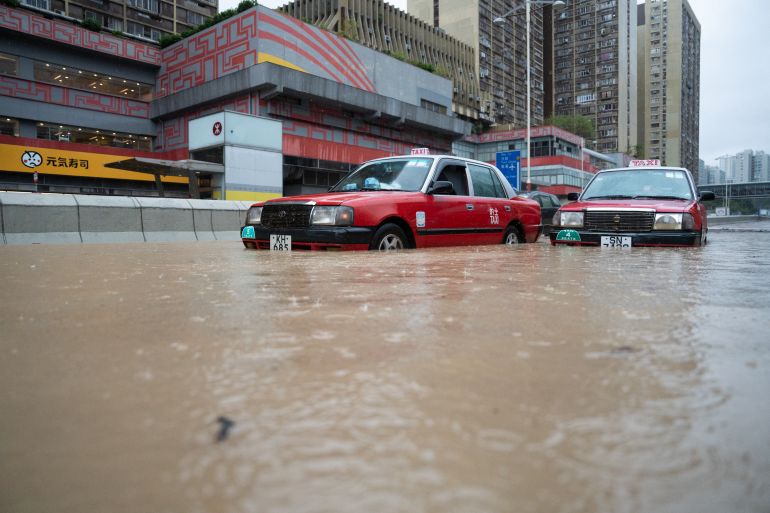 Stranded taxis are pictured on a flooded road in Hong Kong