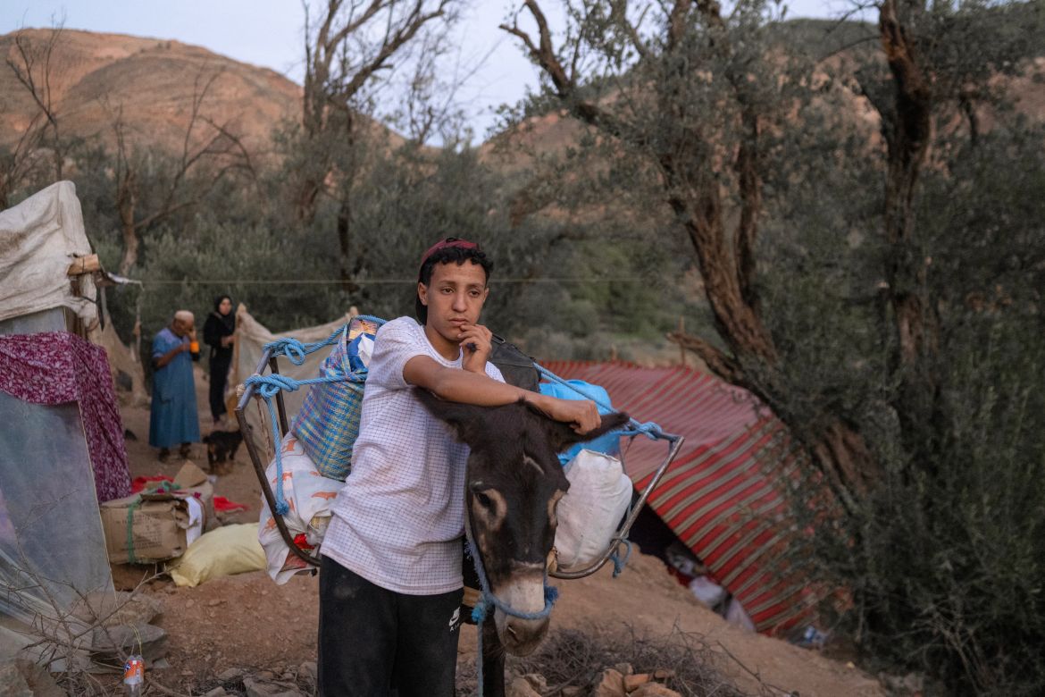 A youth transports goods to his village on the back of a donkey as roads are blocked in the mountainous area of Tizi N'Test, in the Taroudant province, one of the most devastated in quake-hit Morocco