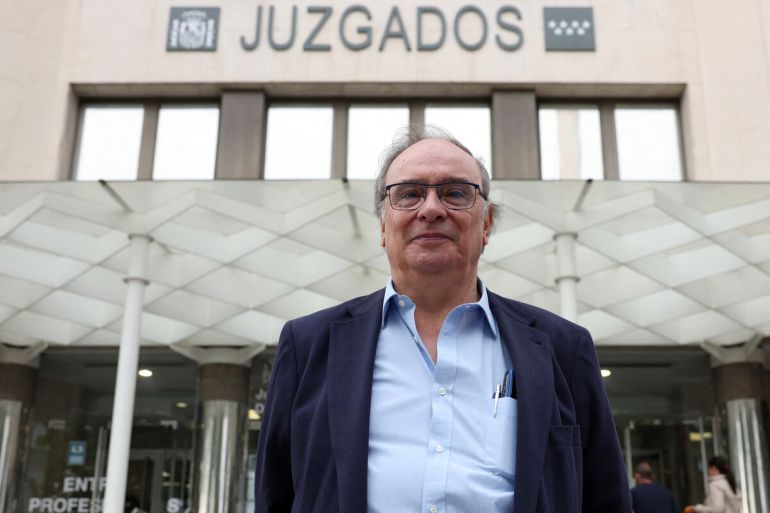 Franco dictatorship victim Julio Pacheco Yepes poses outside the courthouse prior to his hearing in Madrid