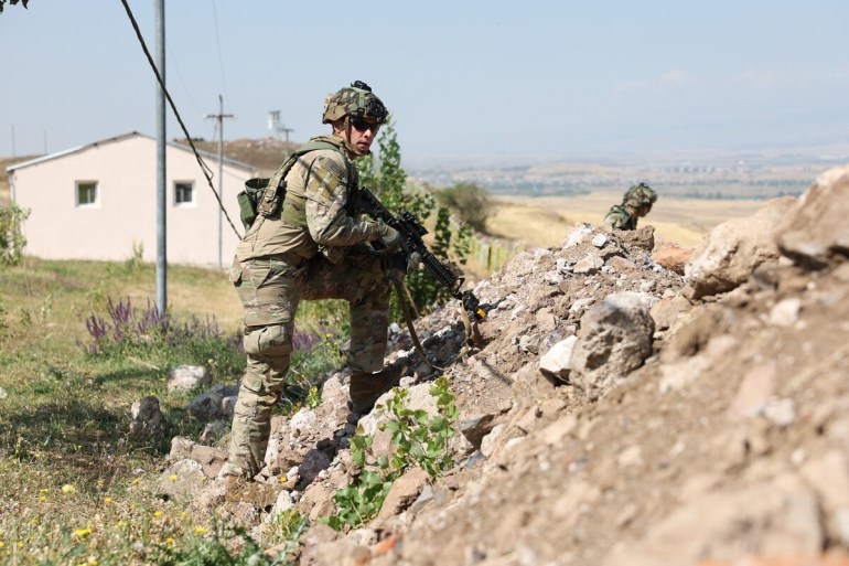 In this handout photograph taken and released by Armenian Defence Ministry on September 15, 2023, a US serviceman takes part in the Eagle Partner 2023 Armenia-US joint drills at Zar Training Center outside Ashtarak.