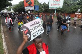 A protester holds up a sign with &#39;Ghana deserves better&#39; on it during a demonstration in Accra against the deteriorating economic conditions in the country, on September 23, 2023 [Nipah Dennis/AFP]