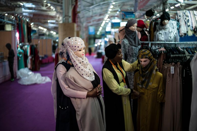 epa06637269 Storekeepers prepare mannequins prior the Muslim fair opens to public at Le Bourget exhibition center, near Paris, France, 30 March 2018. The fair runs from 30 March to 02 April 2018. EPA-EFE/YOAN VALAT